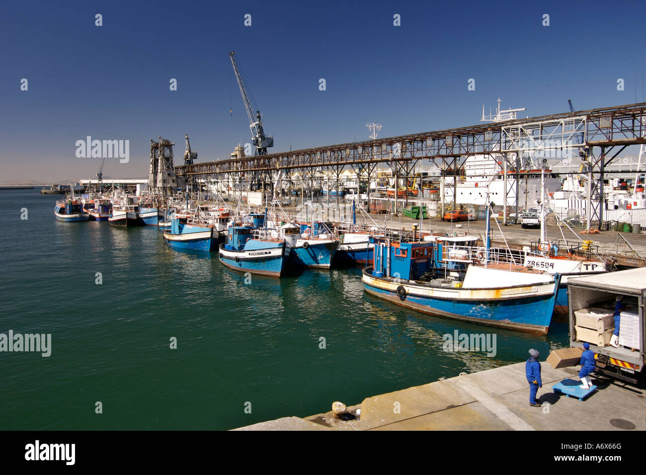 Fishing boats moored in the waterfront at the harbour in Cape Town South Africa. Stock Photo