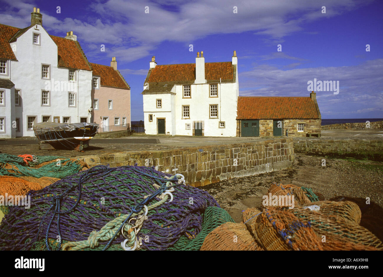 Harbour-side houses and fishing nets at Pittenweem, East Neuk of Fife, Scotland, UK. Stock Photo
