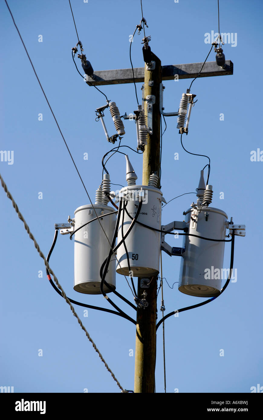 Electrical transformers located on poles in a residential neighborhoods