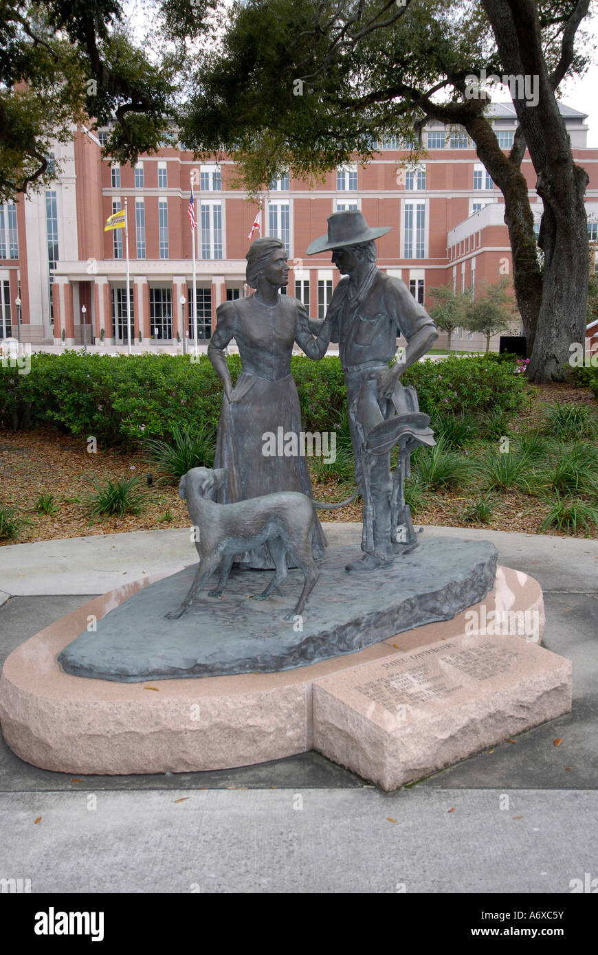 Statue of the Pioneer Family on the lawn of the new and historic Courthouses in Historic downtown Kissimmee Florida FL Stock Photo