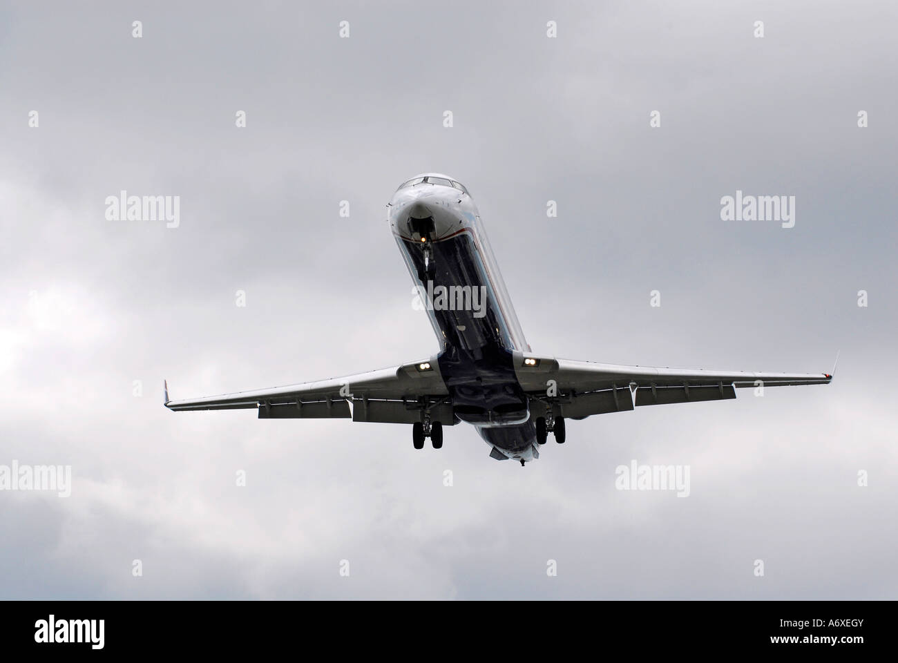 Passenger jet aircraft fly in and out of Sarasota Florida FL Fla airport Stock Photo