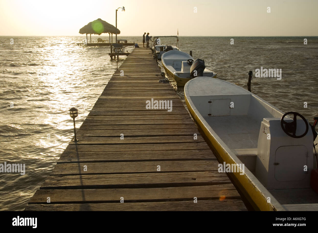 BELIZE Ambergris Caye Fishing boats tied to dock in early morning