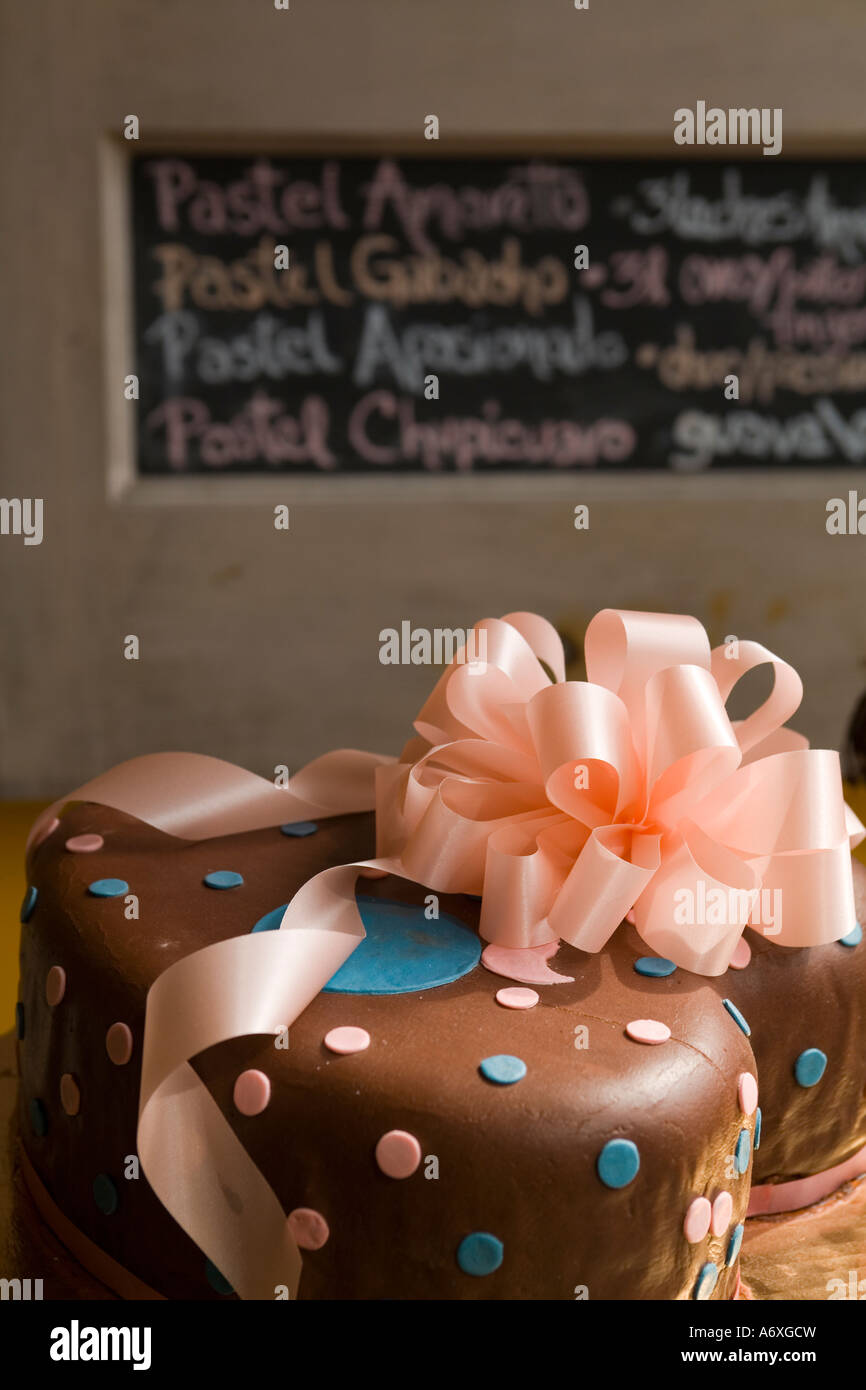 ILLINOIS Chicago Decorated cakes in bakery store window in Pilsen