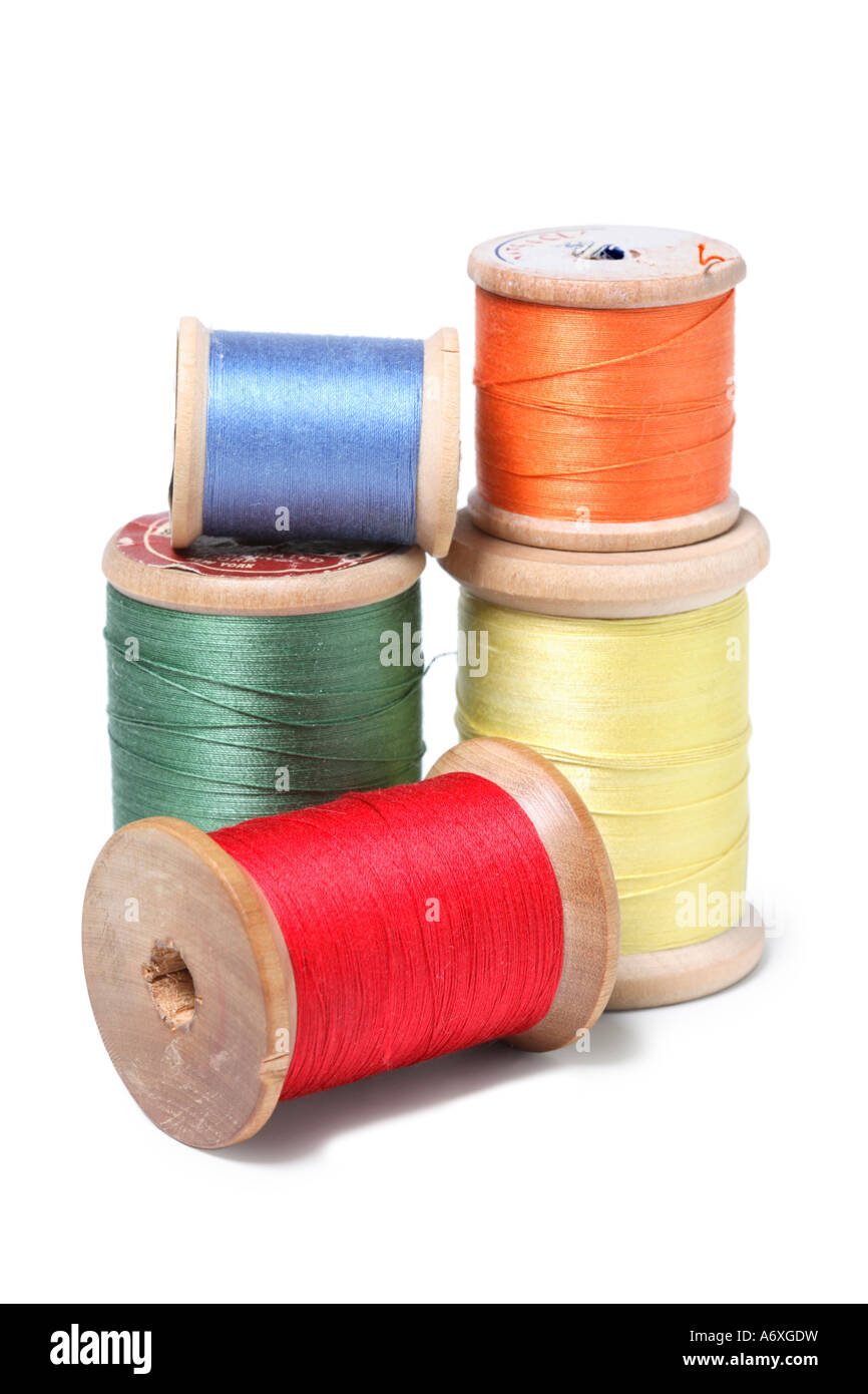 Colorful spools of thread cut out on white background Stock Photo