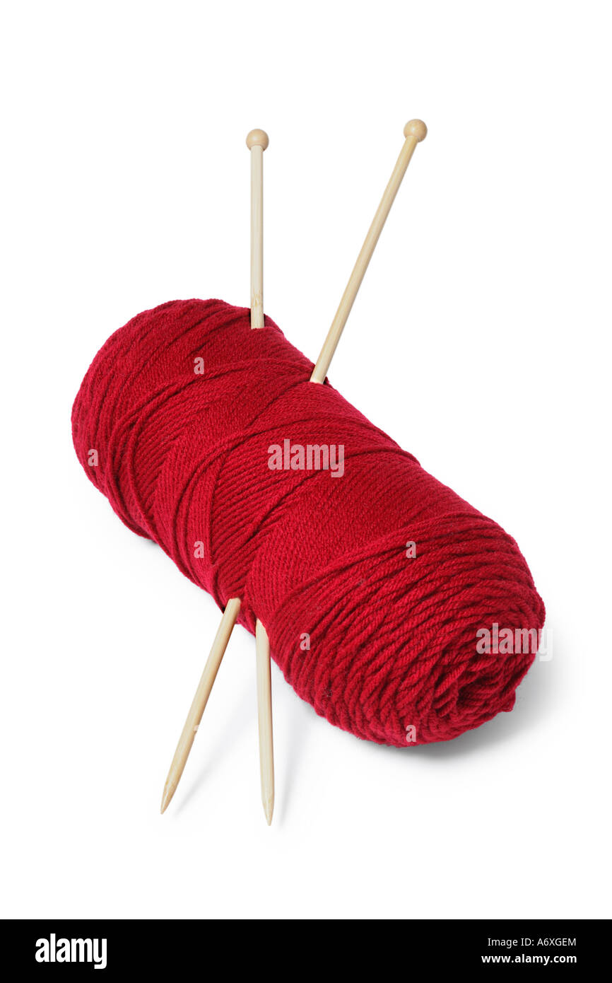 Yarn and knitting needles cut out on white background Stock Photo