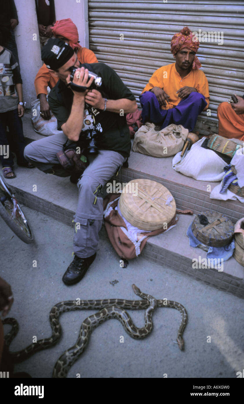 Filming Serpent charmers from India featuring snake showoff in Thamel Kathmandu Nepal Stock Photo