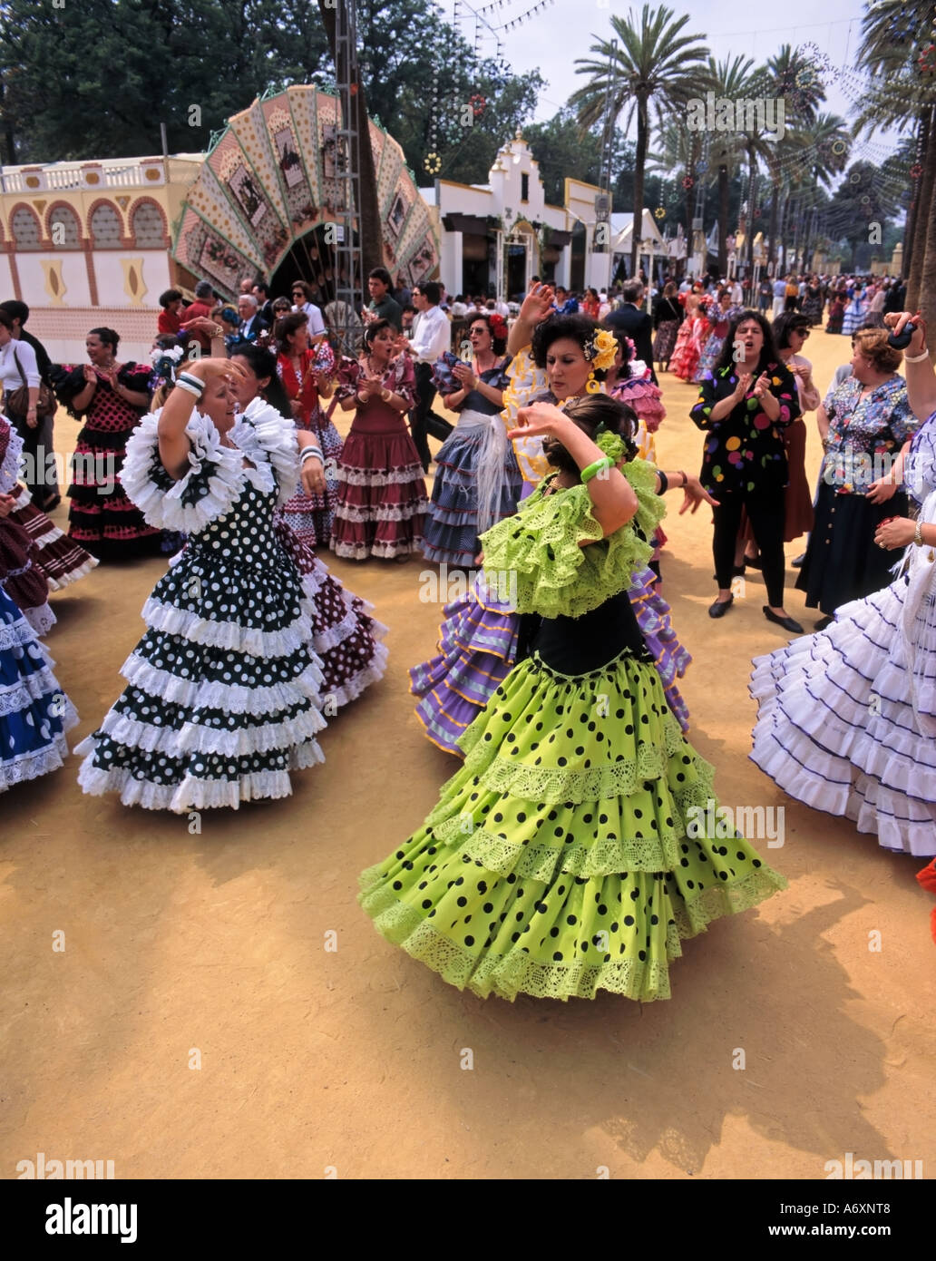 Jerez Horse Fair, Feria del Caballo, ladies flamenco dancing dressed in trajes de gitanas (gypsy dresses), Jerez de la Frontera, Andalusia, Spain Stock Photo