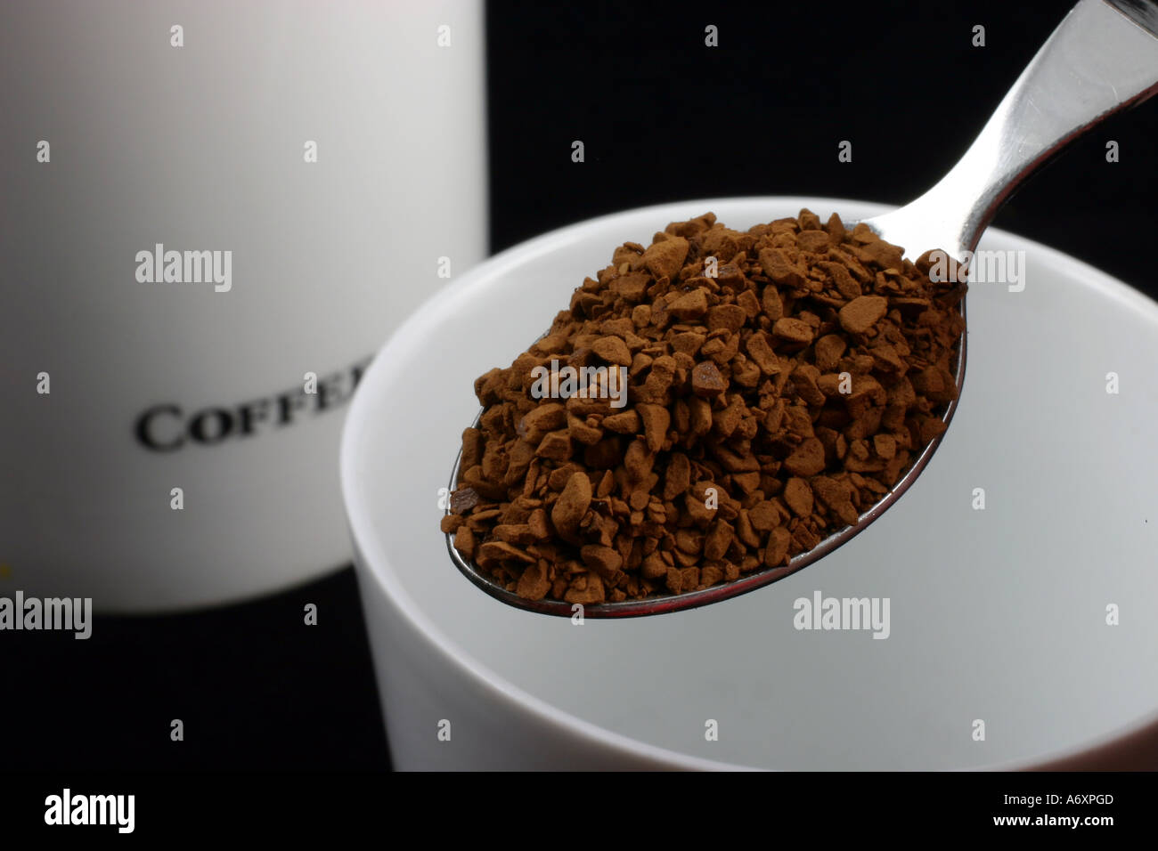 Spoonful of coffee with jar Stock Photo Alamy