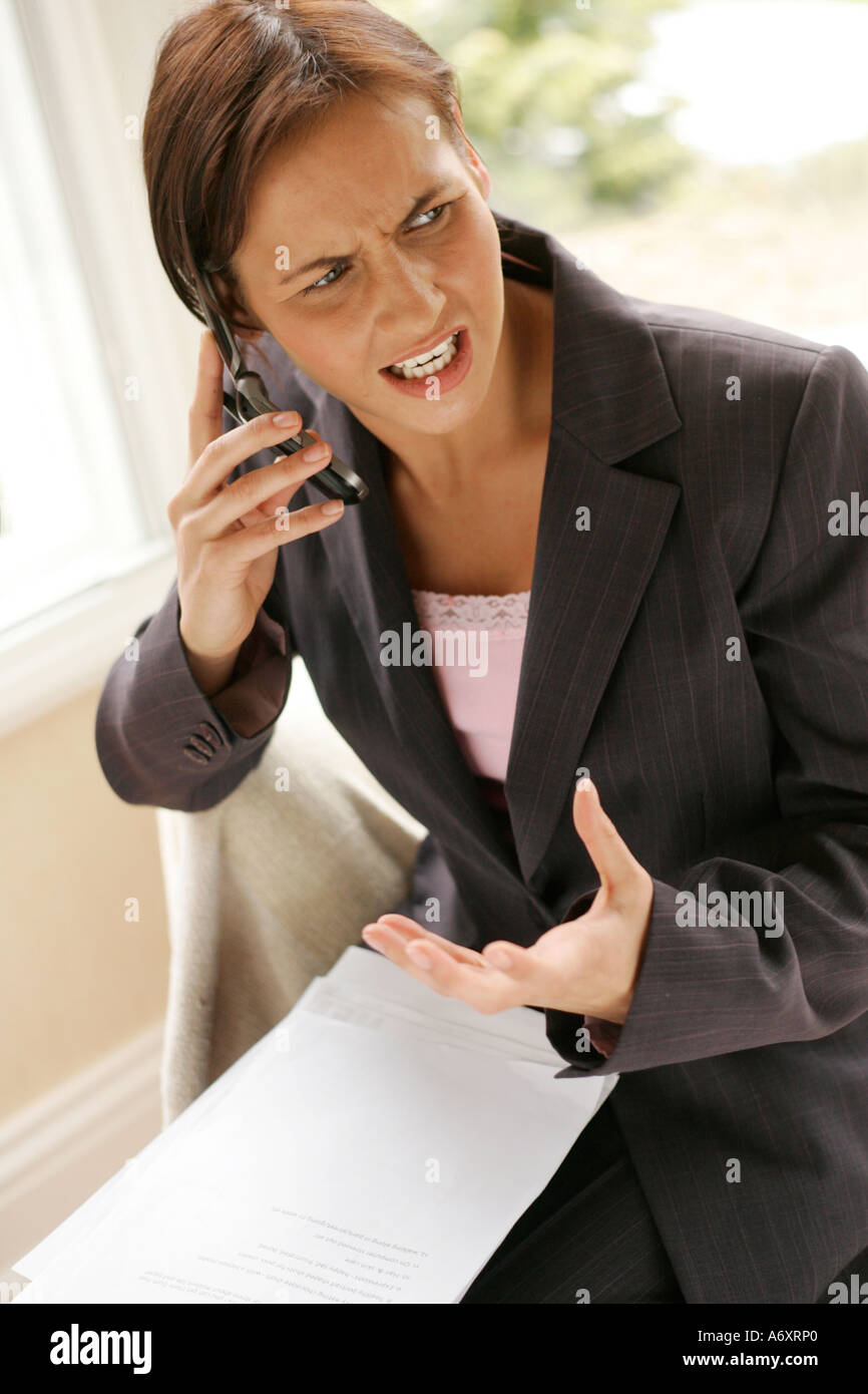 Woman complaining on the phone Stock Photo