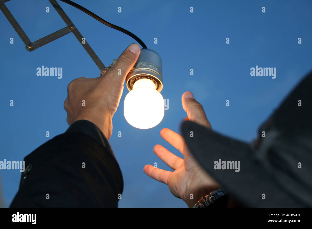 Replacing light bulb Stock Photo - Alamy