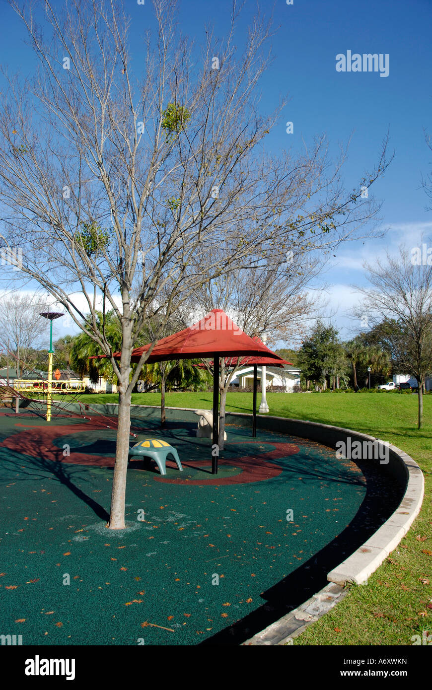 Recycled rubber tires are the base for a children's play area in Barnett Family Park in downtown Lakeland Florida FL USA Stock Photo