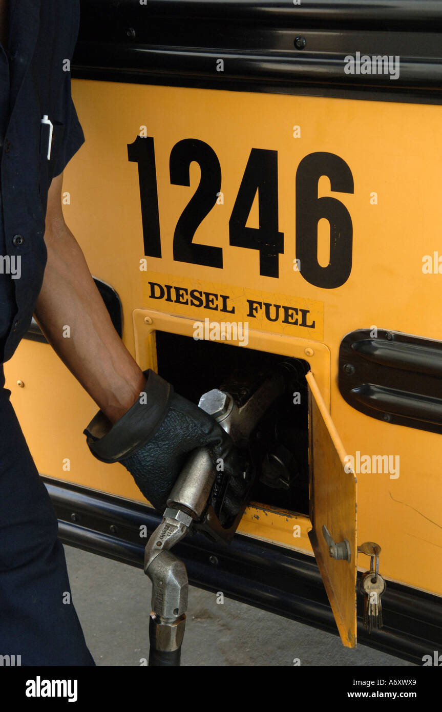 School system employee fuels a diesel powered school bus Decatur GA ...