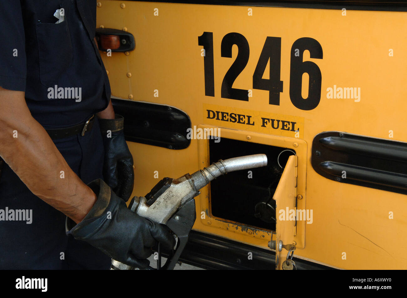 School system employee fuels a diesel powered school bus Decatur GA ...
