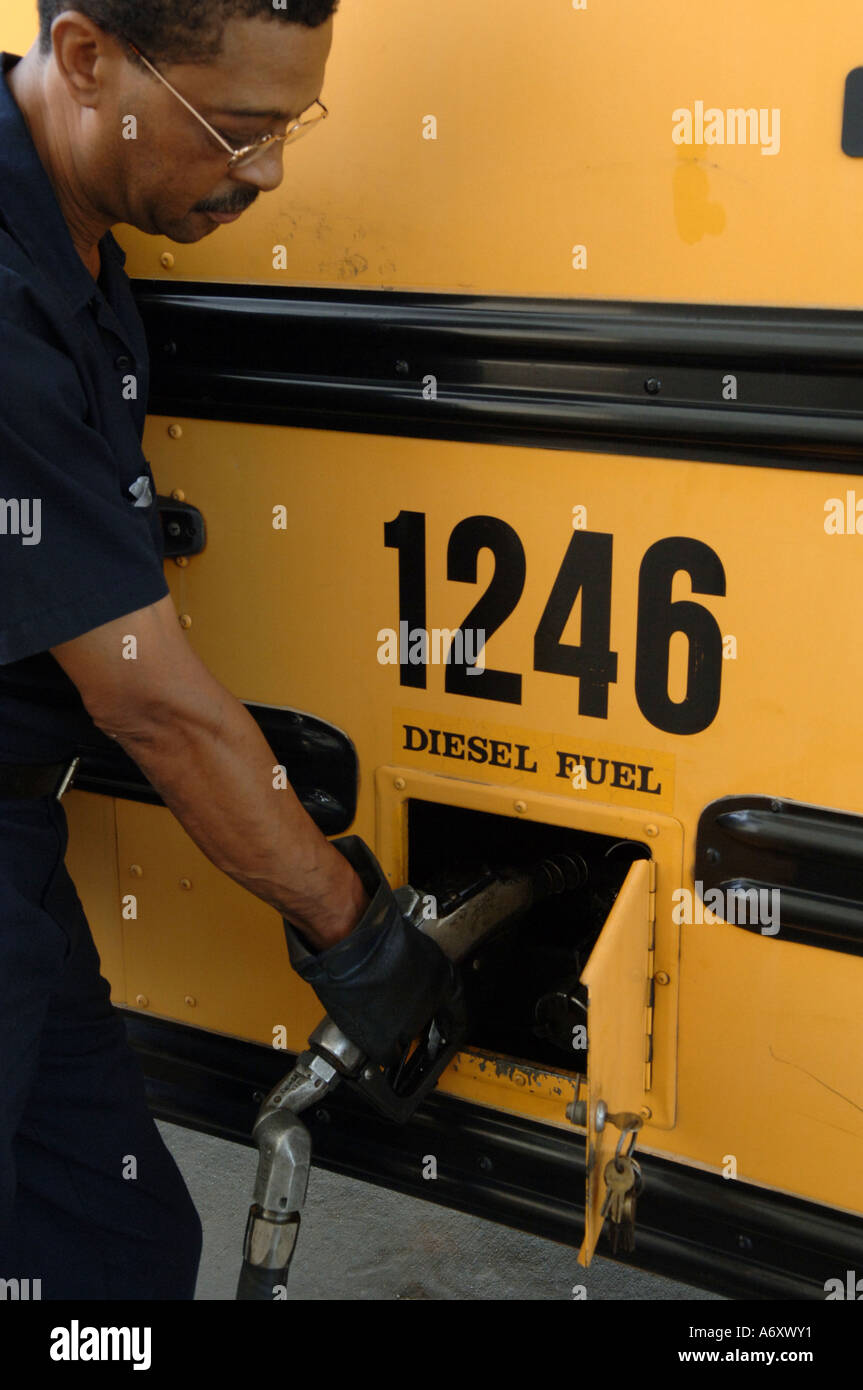 School system employee fuels a diesel powered school bus Decatur GA ...