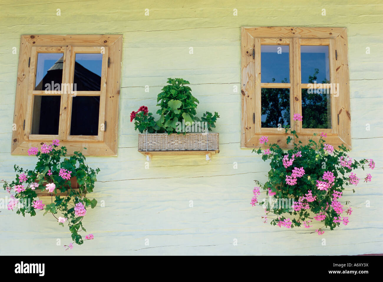 Windows of one of unique village architecture houses in Vlkolinec village UNESCO World Heritage Site Velka Fatra mountains Sl Stock Photo