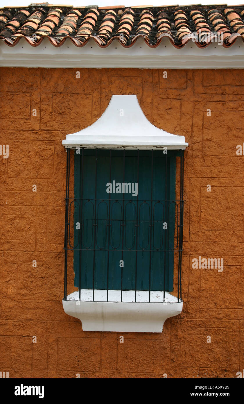 window in an orange building Stock Photo