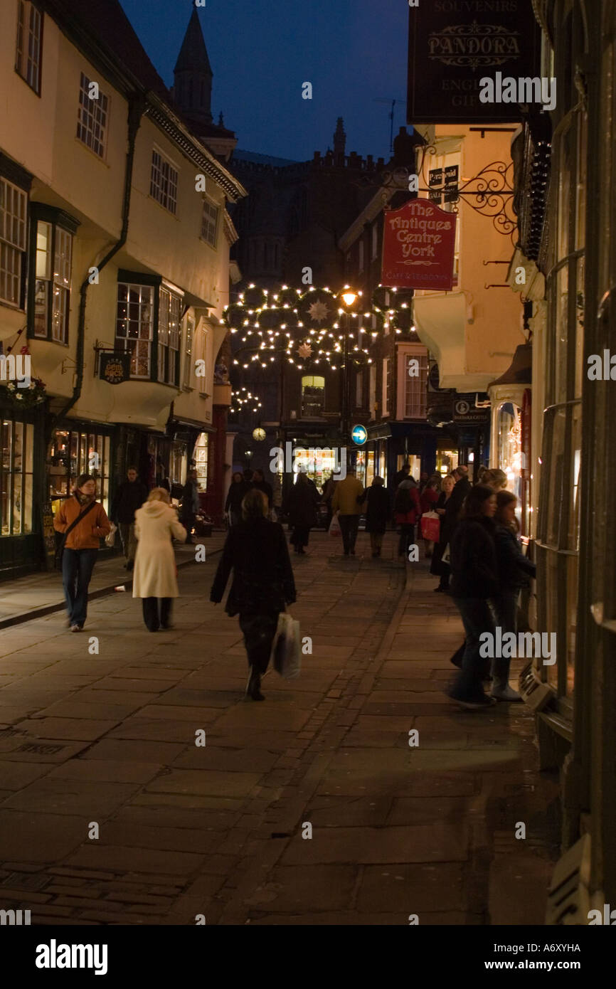 Christmas shoppers in Stonegate York North Yorkshire Early evening with
