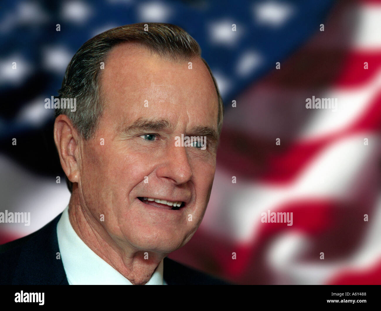 Archive commissioned portrait of former President George H W Bush with American stars and stripes flag behind Stock Photo