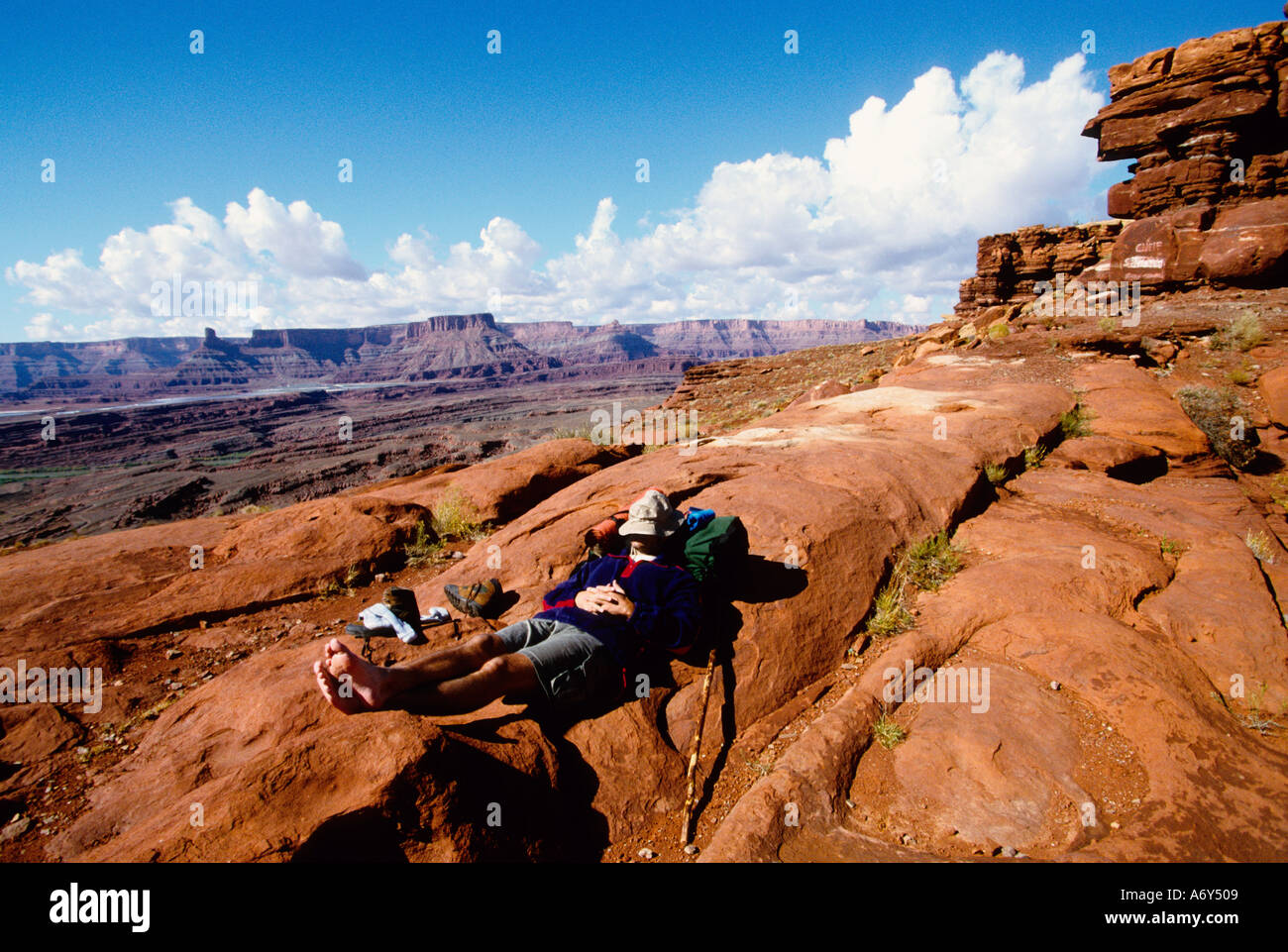 Backpacker taking a rest near Moab Utah USA Stock Photo
