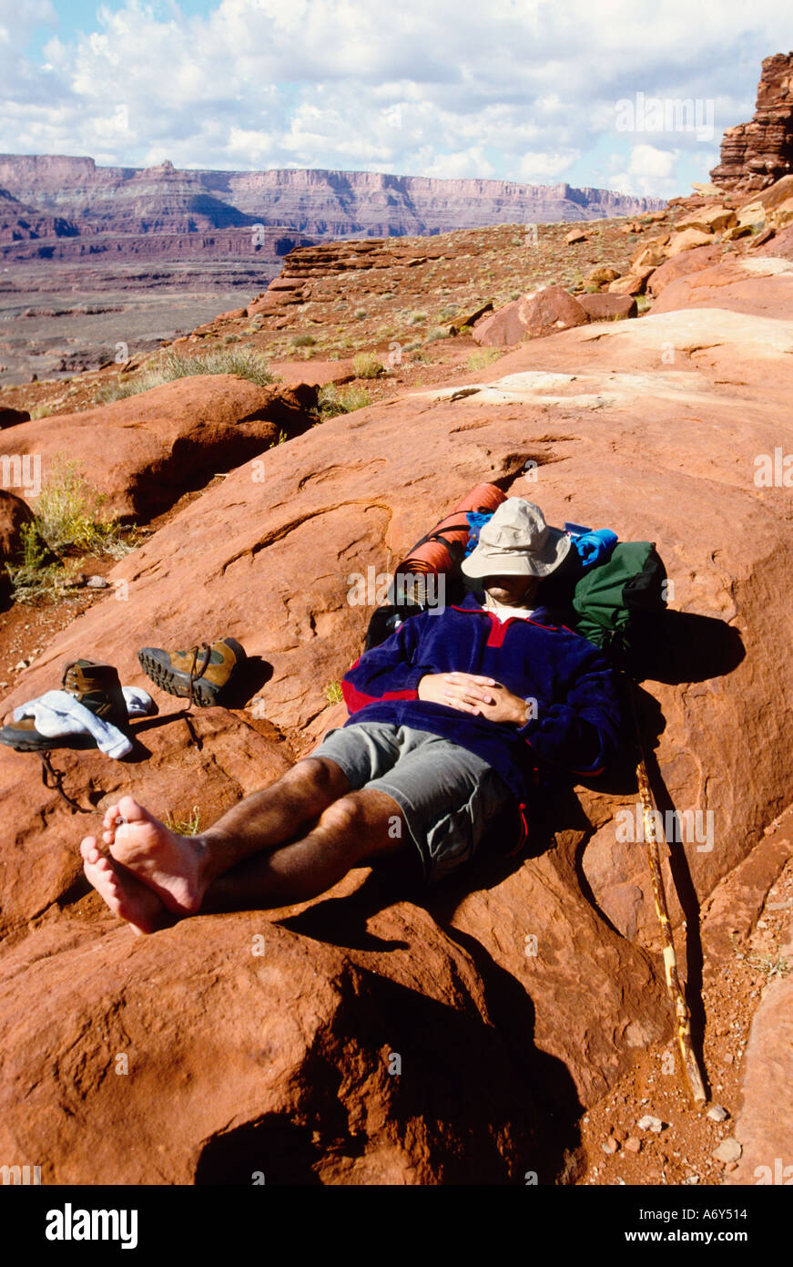 Backpacker taking a rest near Moab Utah USA Stock Photo