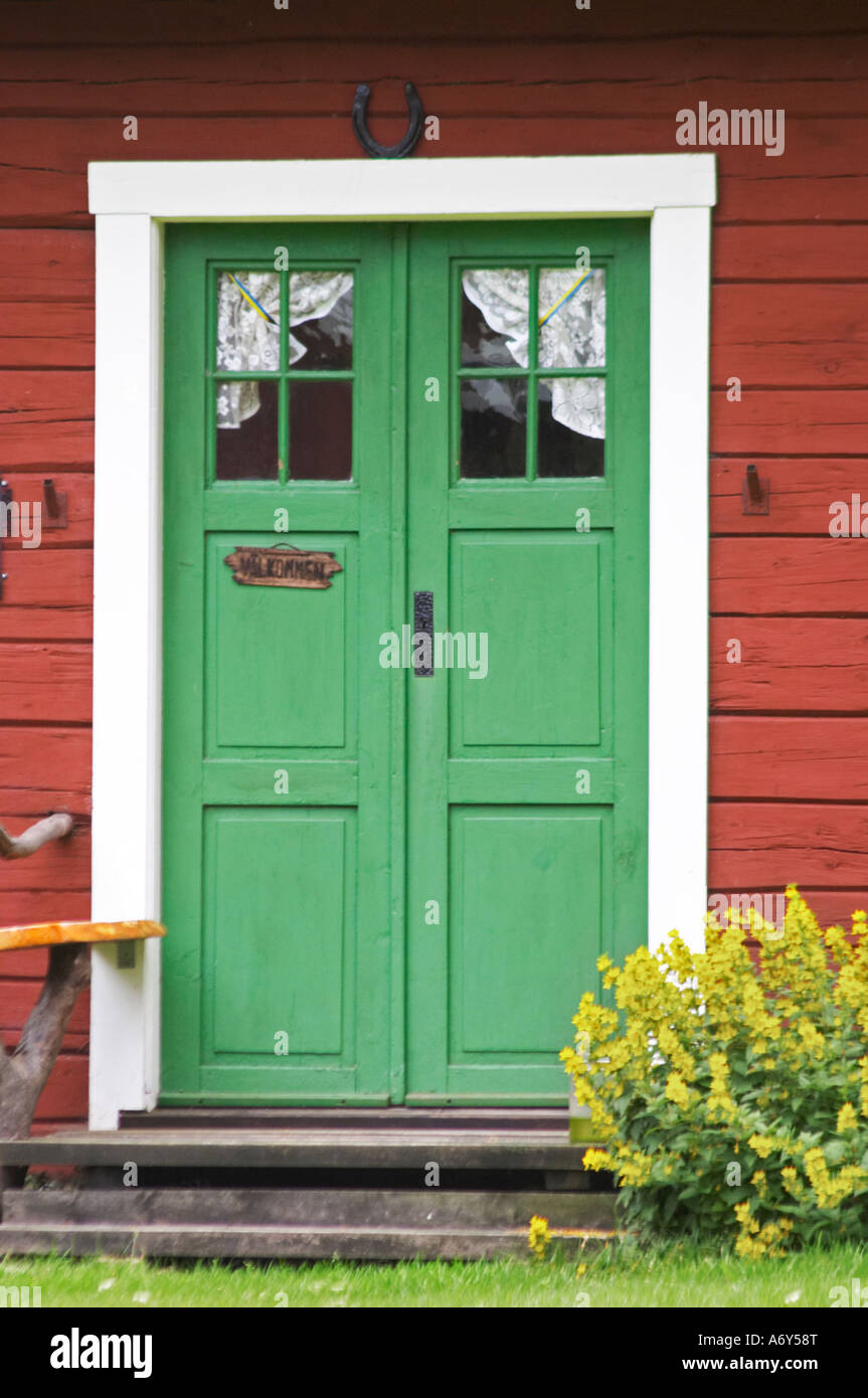 Traditional style Swedish wooden painted house. A door Smaland region