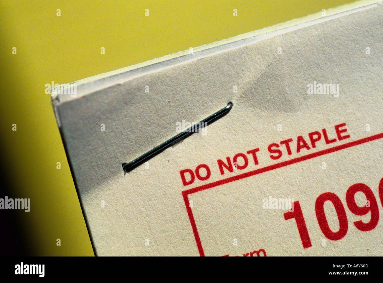 A stapled a business tax form that says Do Not Staple  Stock Photo