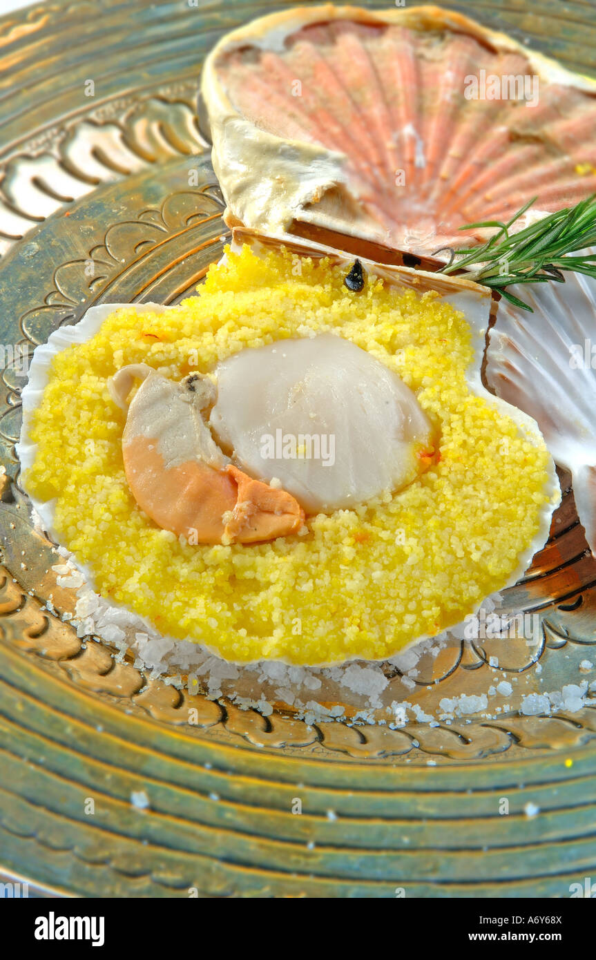 Scallops with saffron semolina cooked with shell Stock Photo - Alamy
