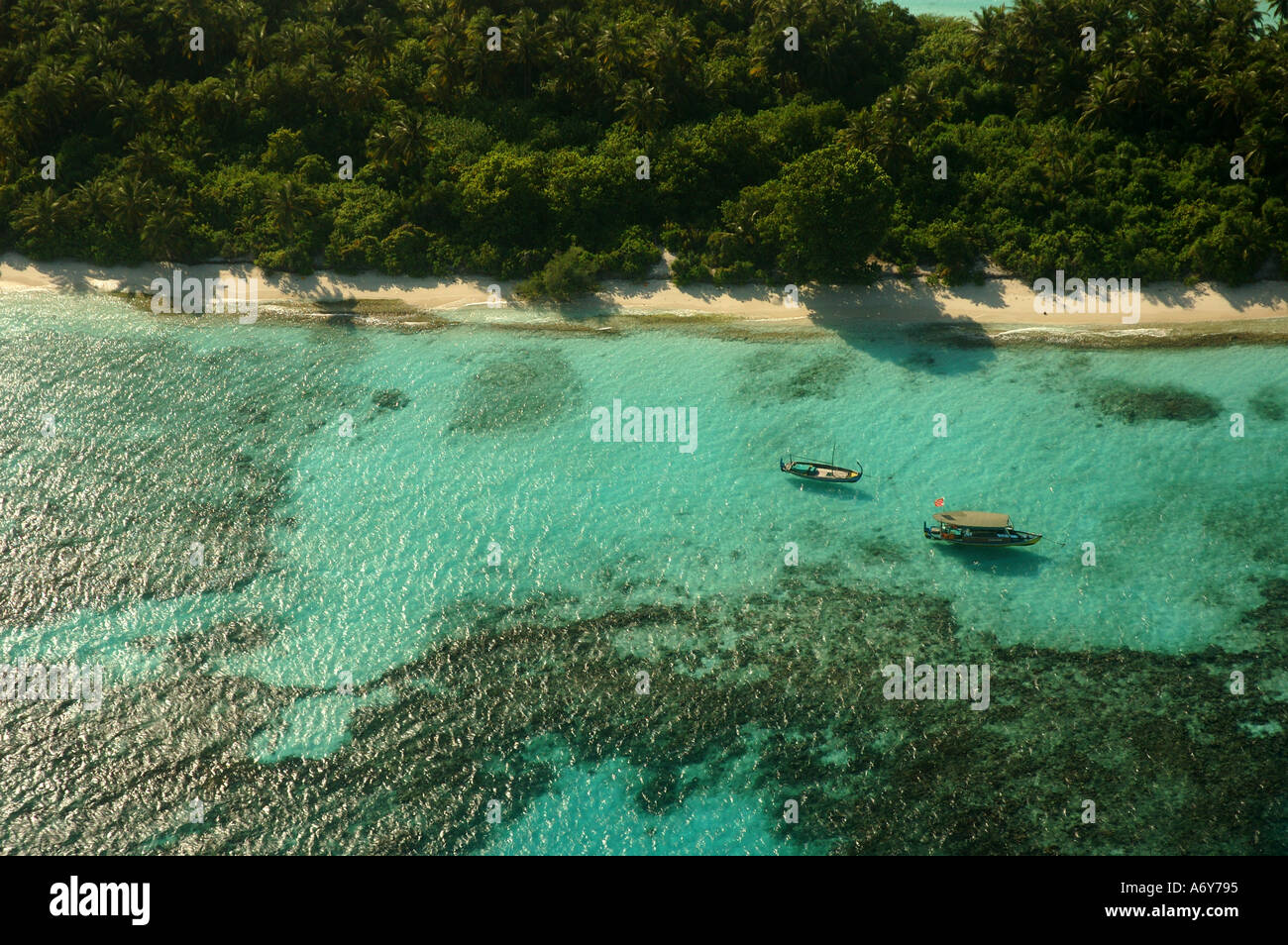 Aerial View of a Maldivian island from air taxi or sea plane en route to resort island Stock Photo