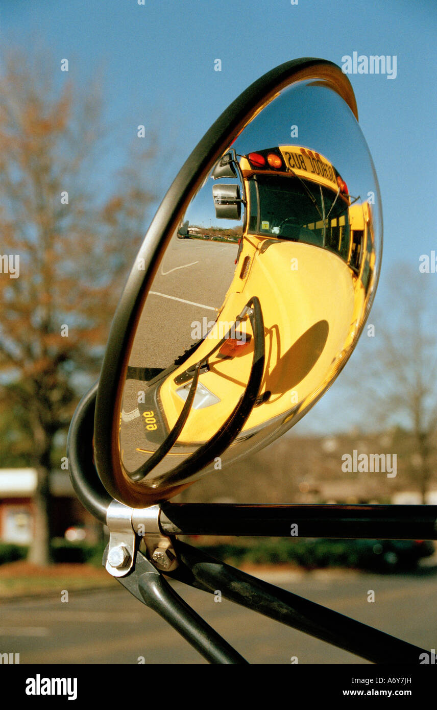 View of school bus in rear view mirror Stock Photo