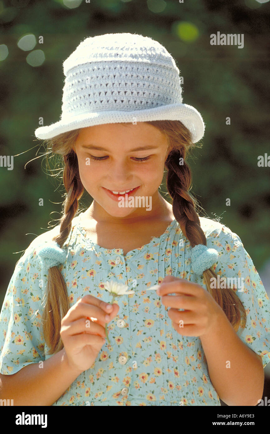 portrait of a girl with a daisy Stock Photo - Alamy
