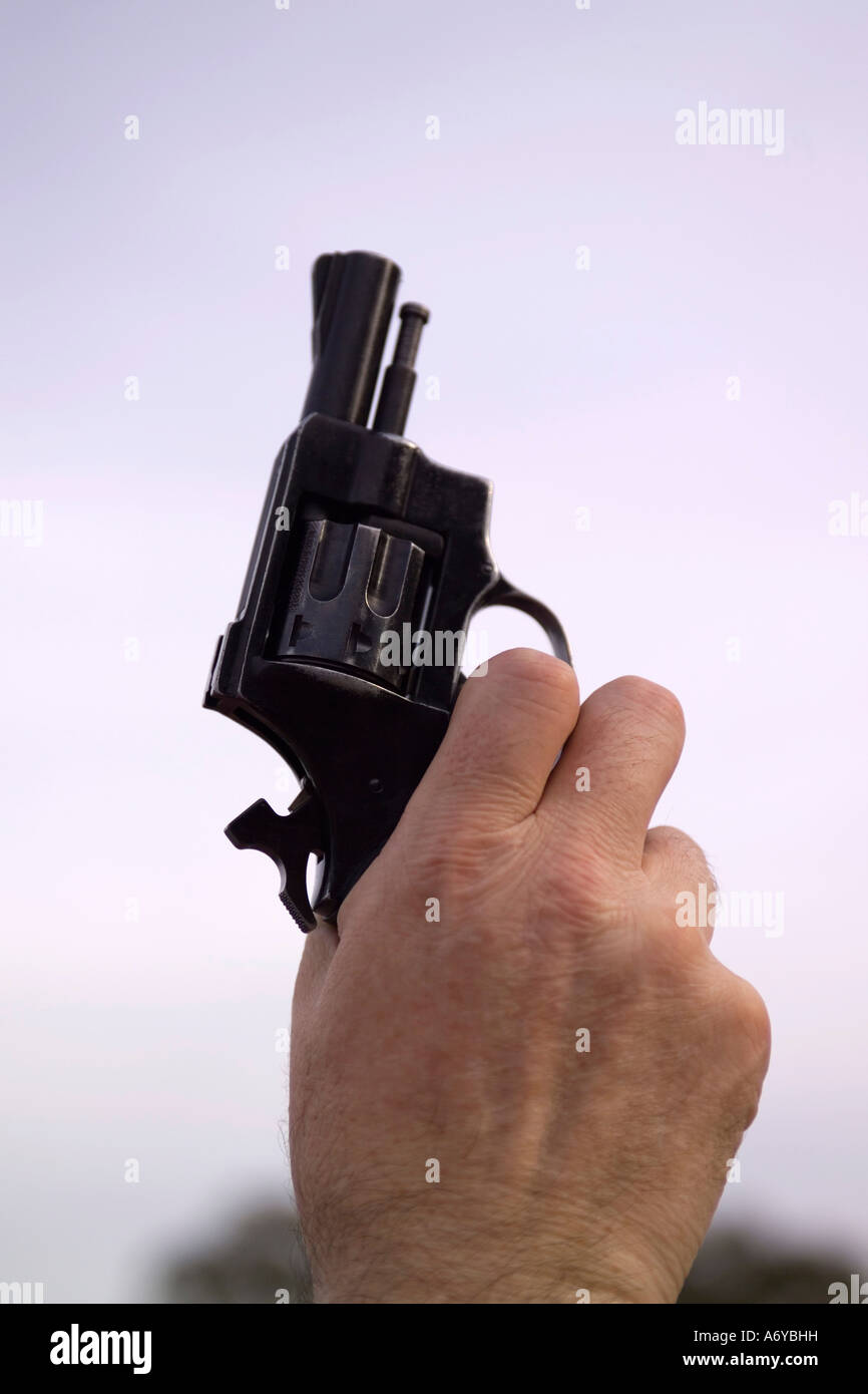 Man holding a starting gun Stock Photo