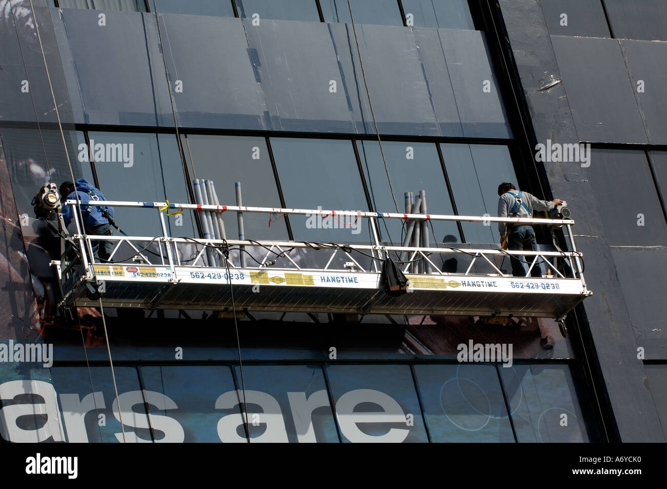 Window washers working on a building in Hollywood California Stock