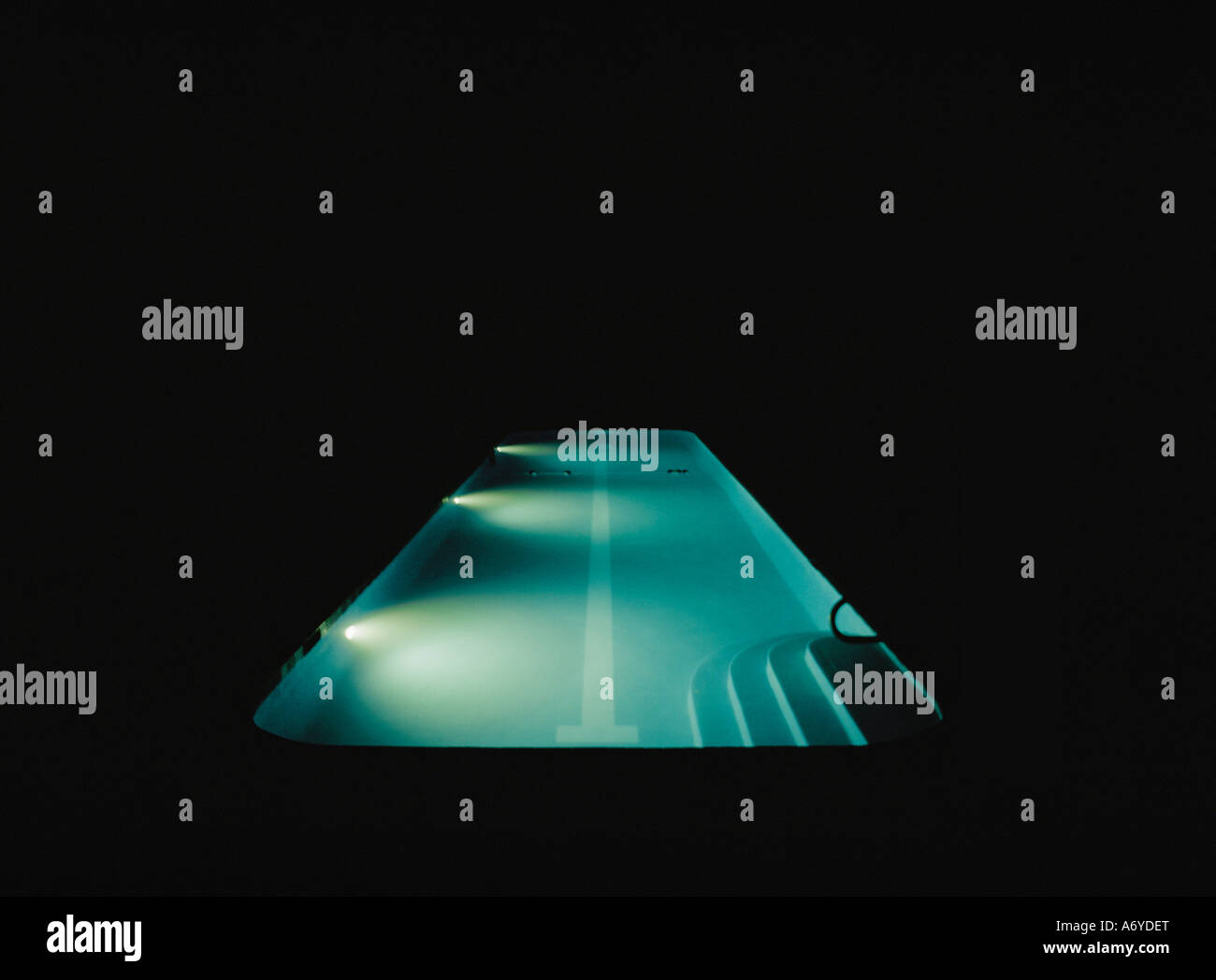 A swimming pool lit at night Stock Photo - Alamy