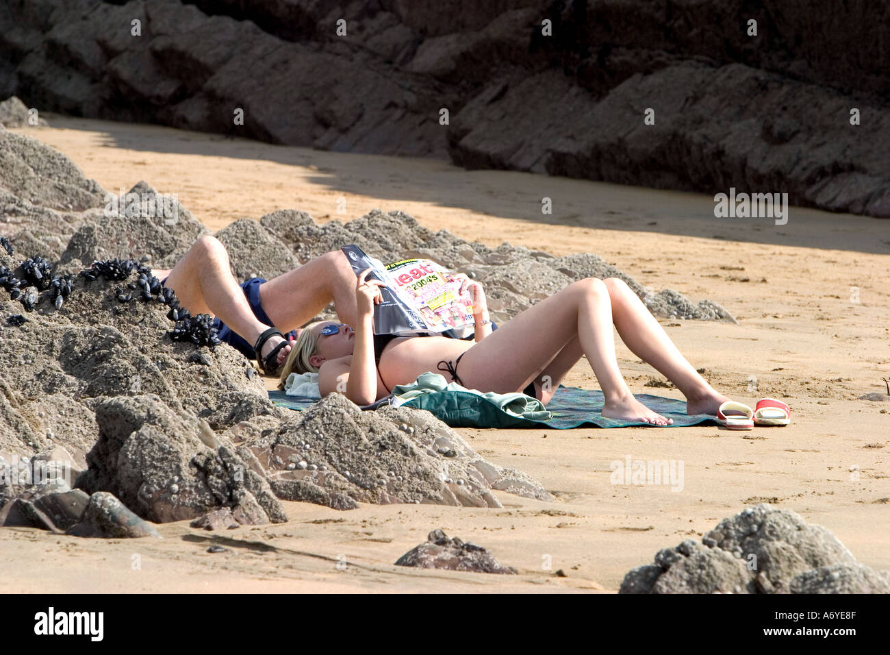 Relaxing on a beach Cornwall England Stock Photo