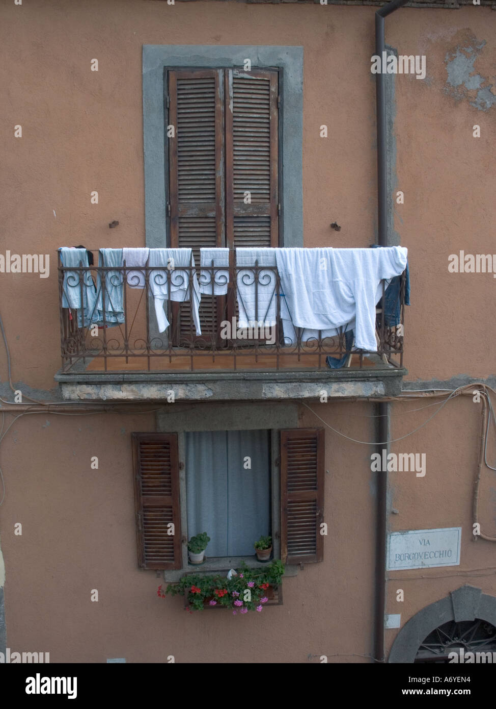 Washing hanging from a balcony in the village of St Martino Al Cimino, Italy Stock Photo