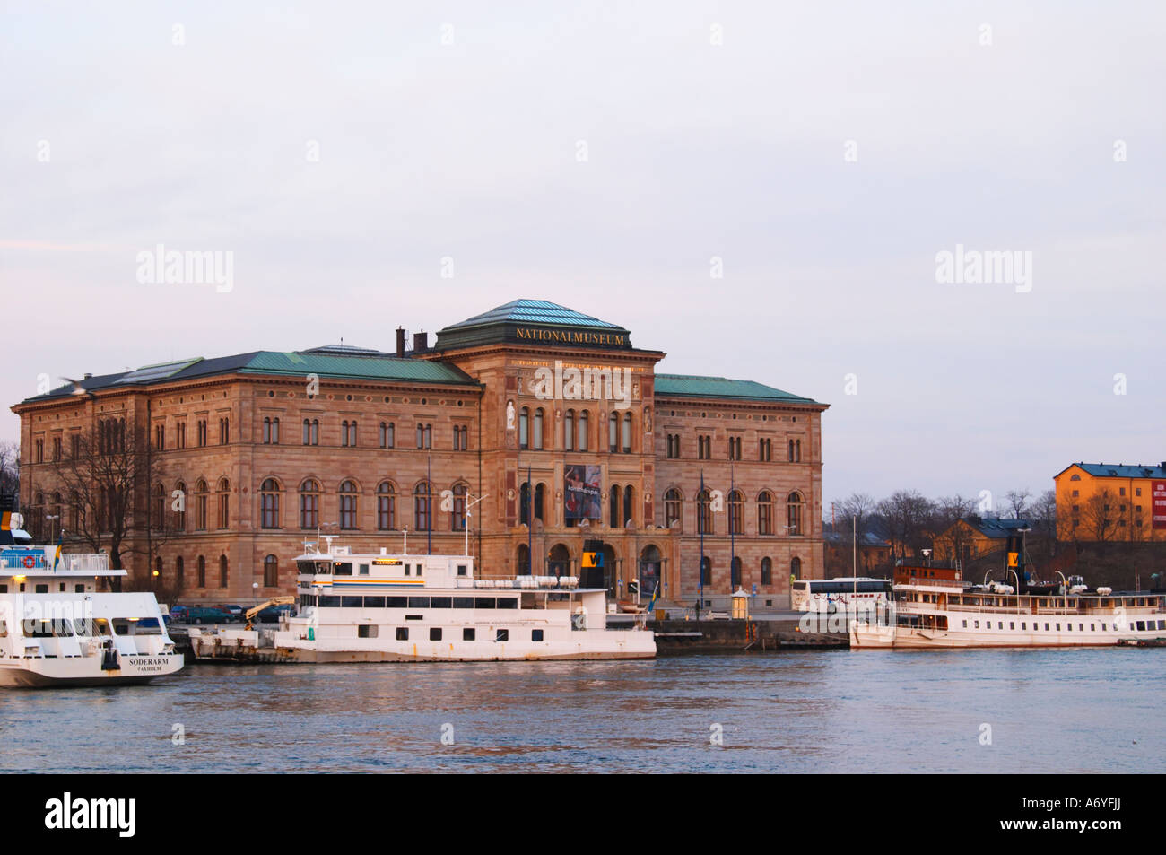The National Museum, Nationalmuseet, for the fine arts on Blasieholmen. White Waxholm boats in front. White Waxholm boats Waxholmsbatar typical for the archipelago traffic. Stockholm. Sweden, Europe. Stock Photo