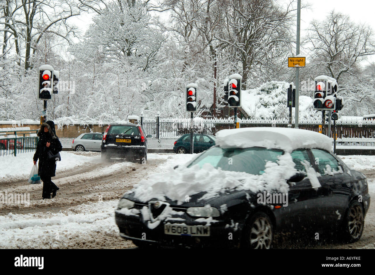 car driving in hazardous winter conditions springtime Scotland Stock ...