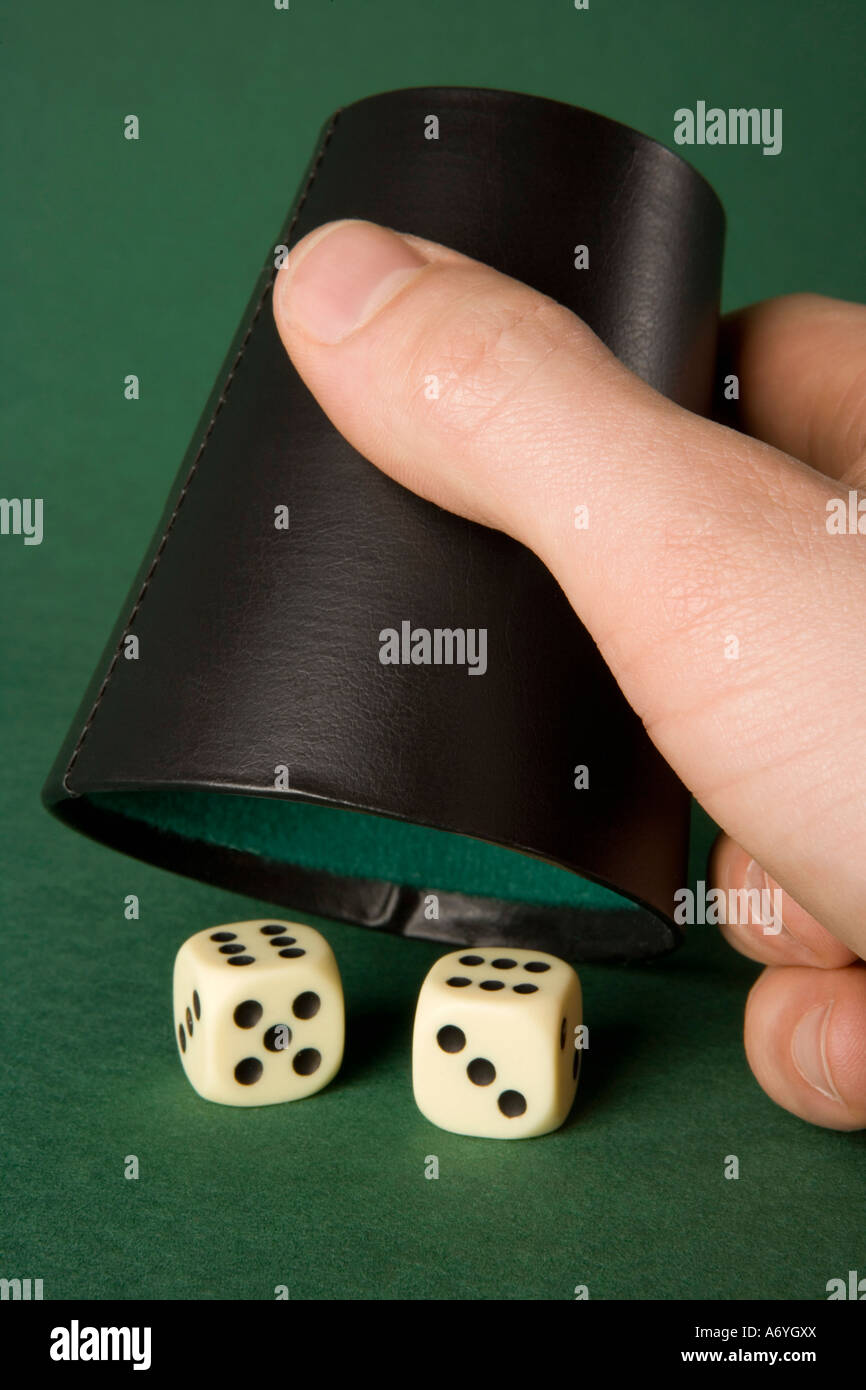 Two dice and a dice cup Stock Photo Alamy