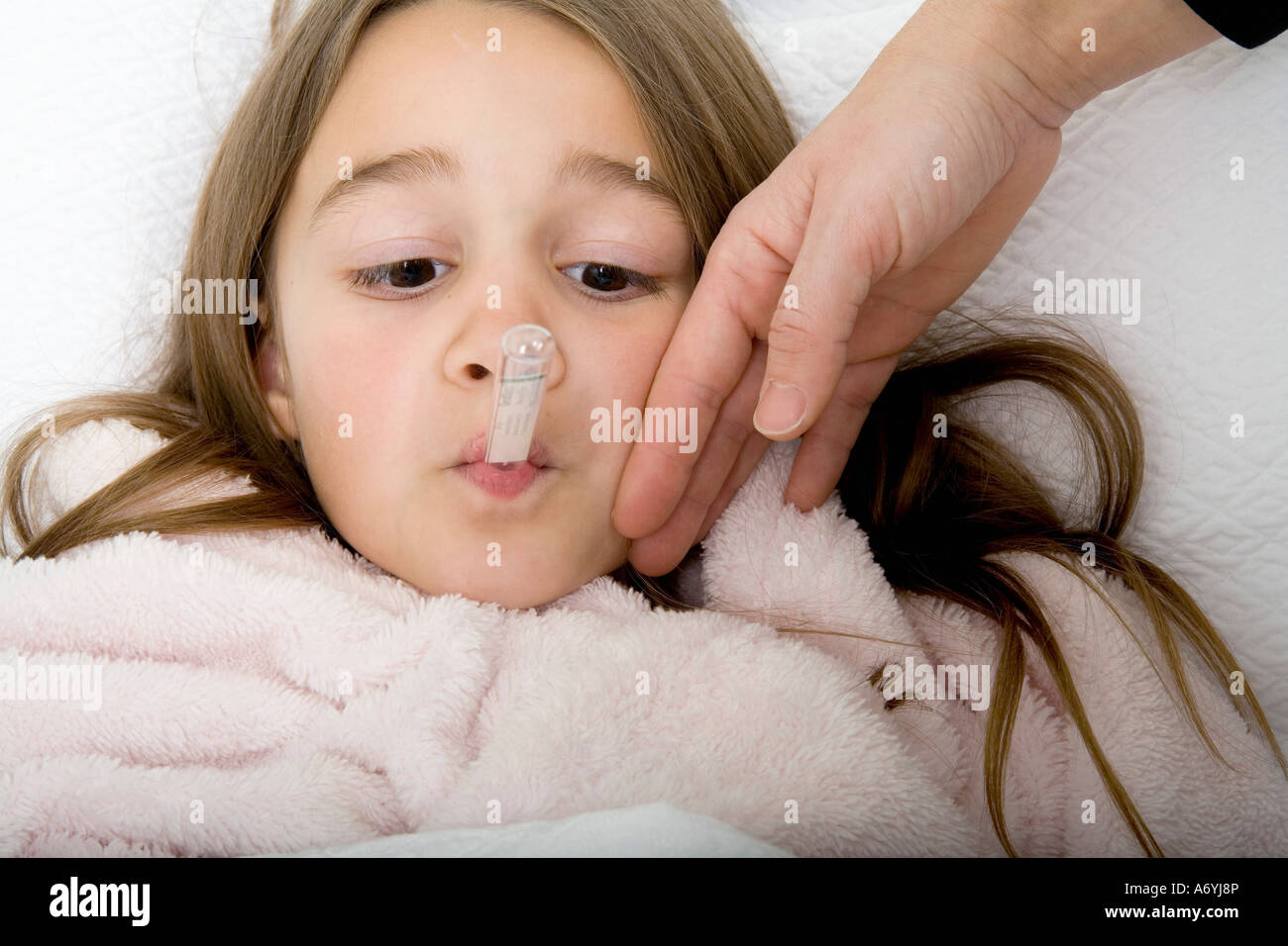 A Girl Lying In Bed Unwell Stock Photo Alamy a-girl-lying-in-bed-unwell-stock-photo-alamy