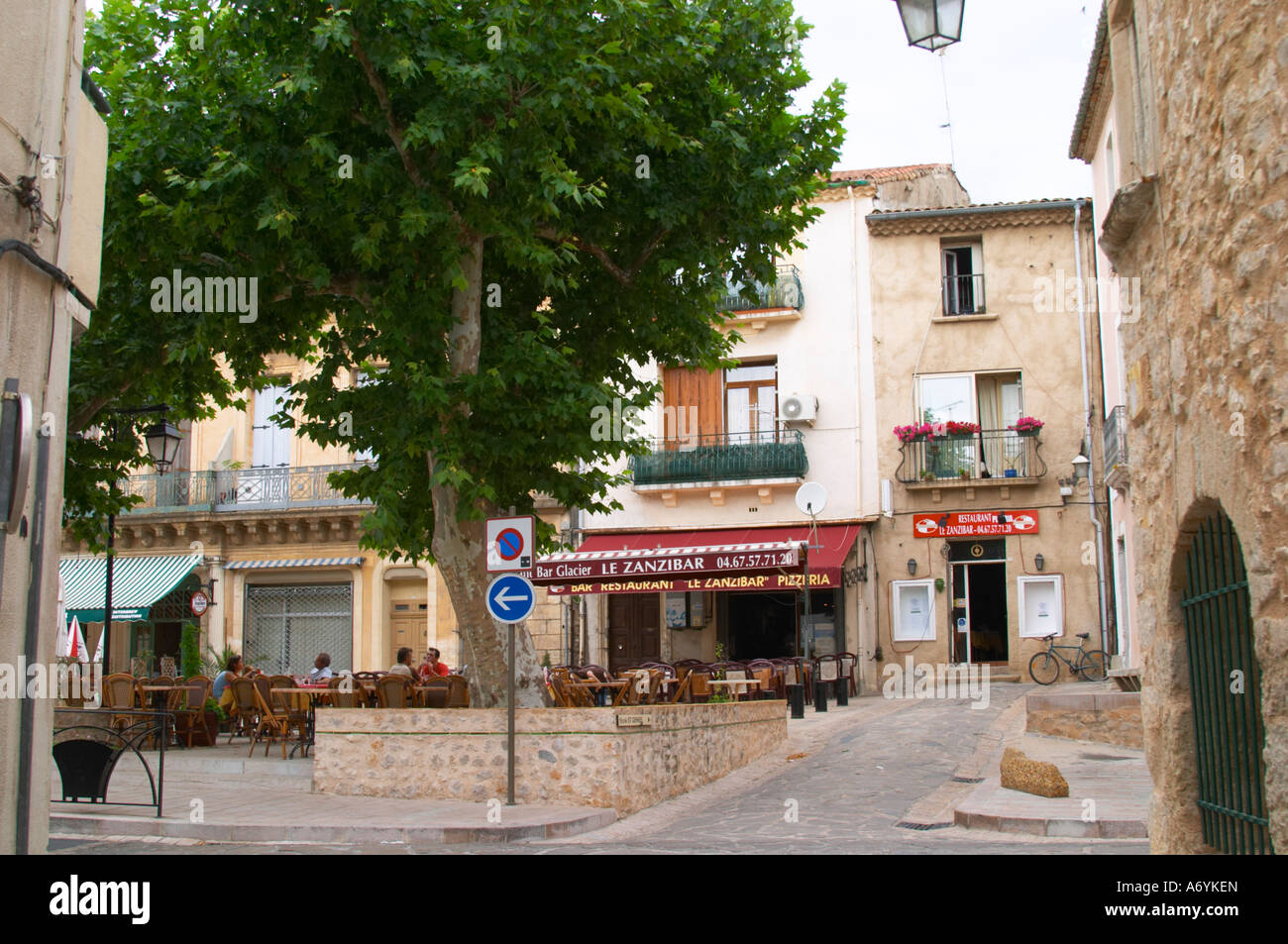 The main village square with cafes and restaurants. St Jean de Fos village.  Languedoc. France. Europe Stock Photo - Alamy