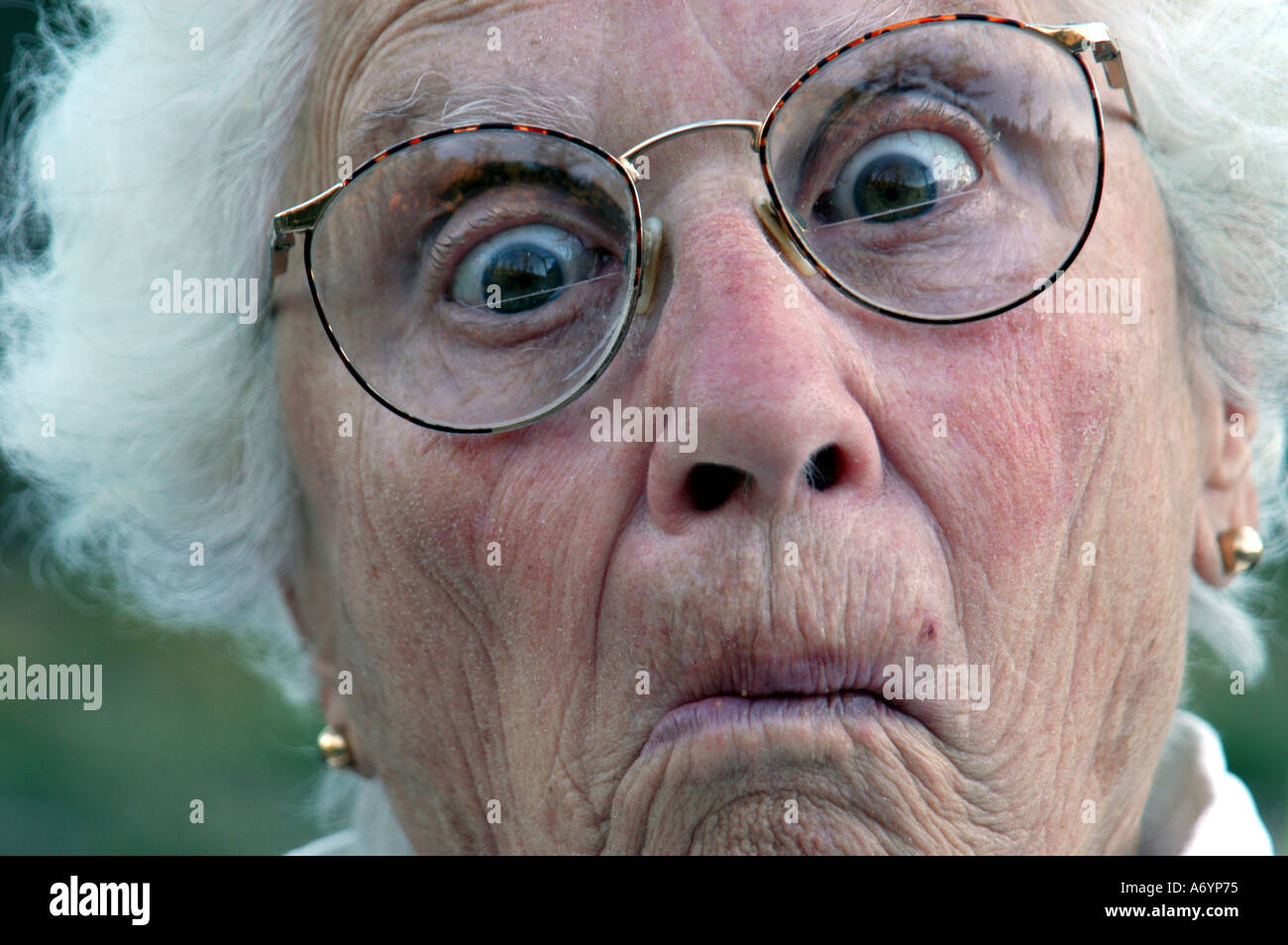 Elderly woman making funny face Stock Photo - Alamy
