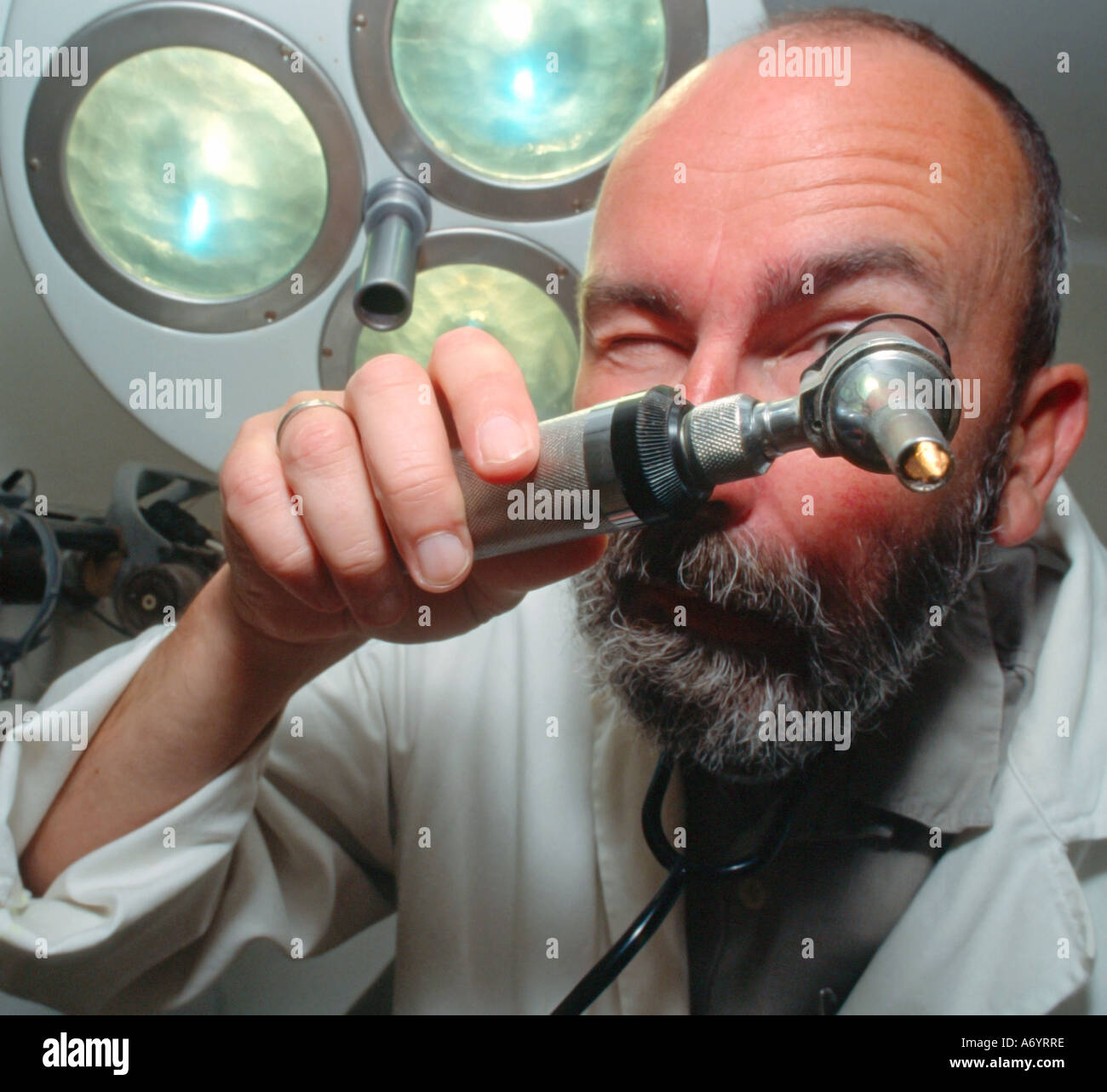 doctor with optical tool MR Stock Photo - Alamy
