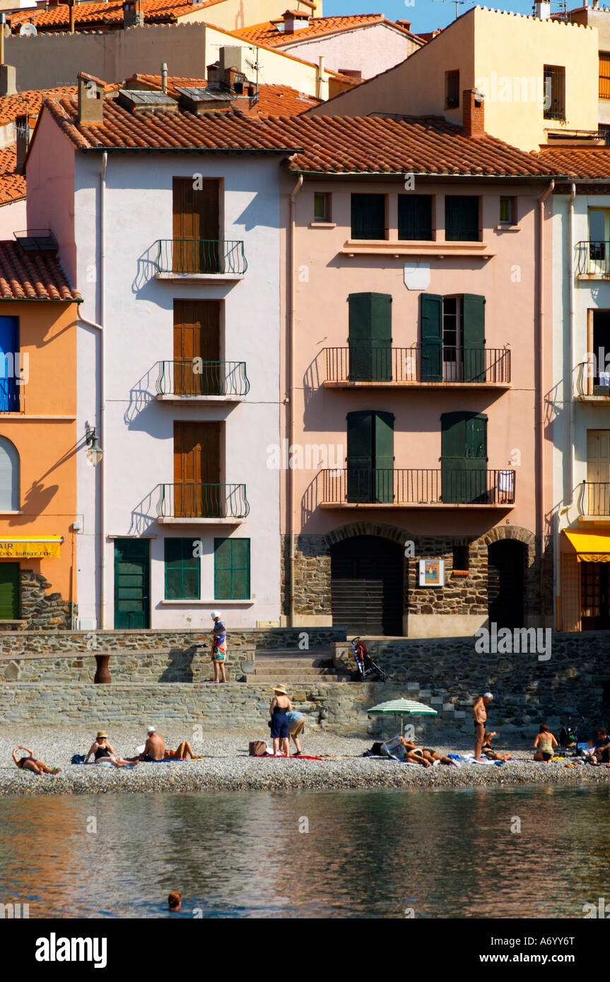 The beach in the village. Colourful houses along the water. Collioure ...
