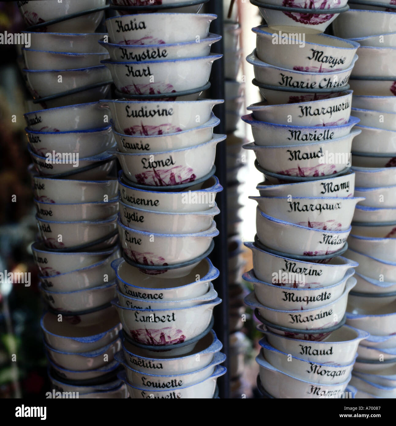 Cups on display in France with French boys and girls names Stock Photo