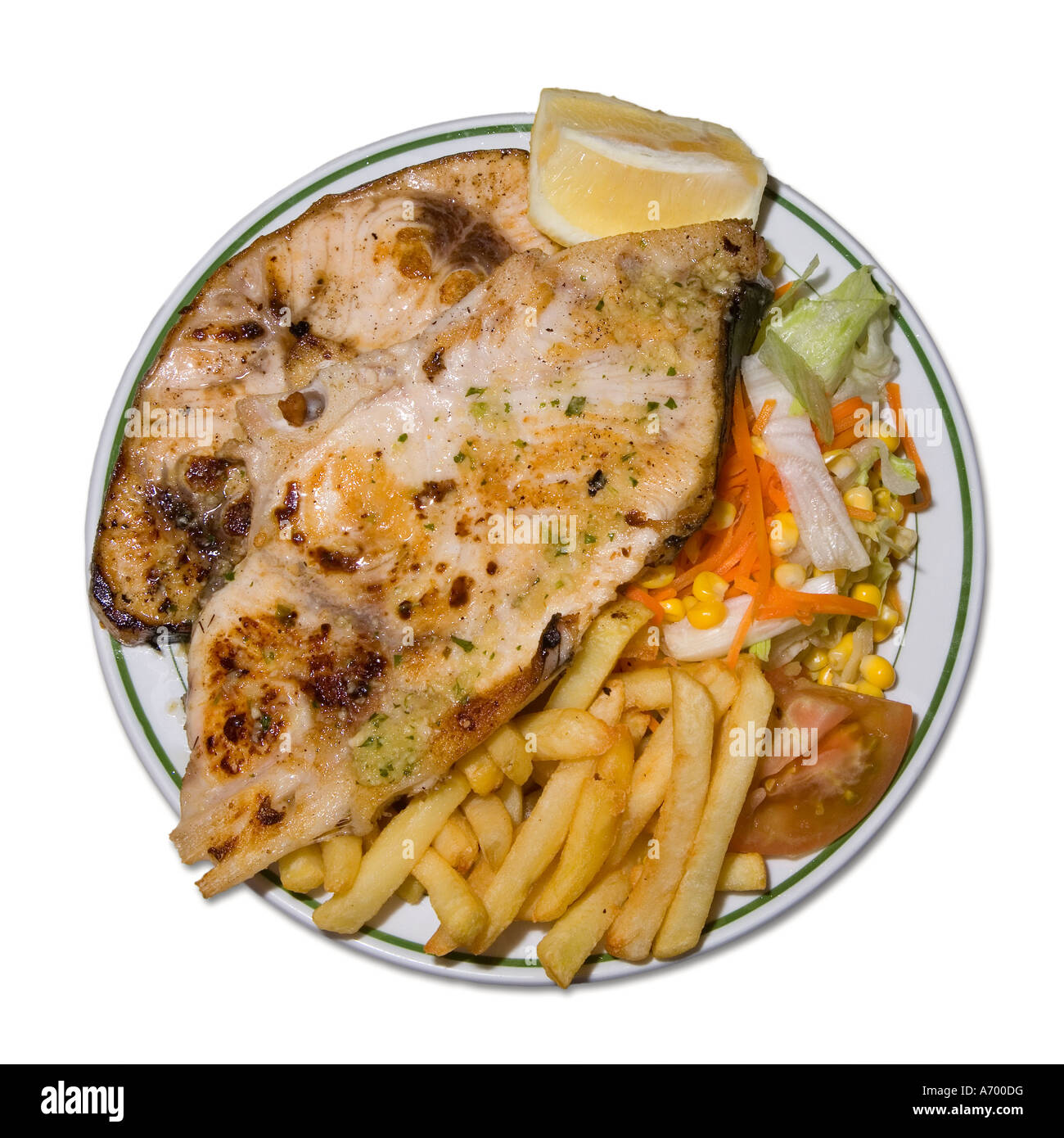 Grilled swordfish steak with chips and salad on white background Spain Stock Photo