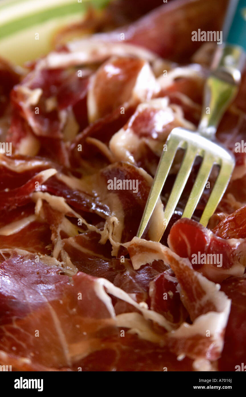 Domaine de Nidoleres. Roussillon. A plate of dry cured ham with a serving fork. France. Europe. Stock Photo