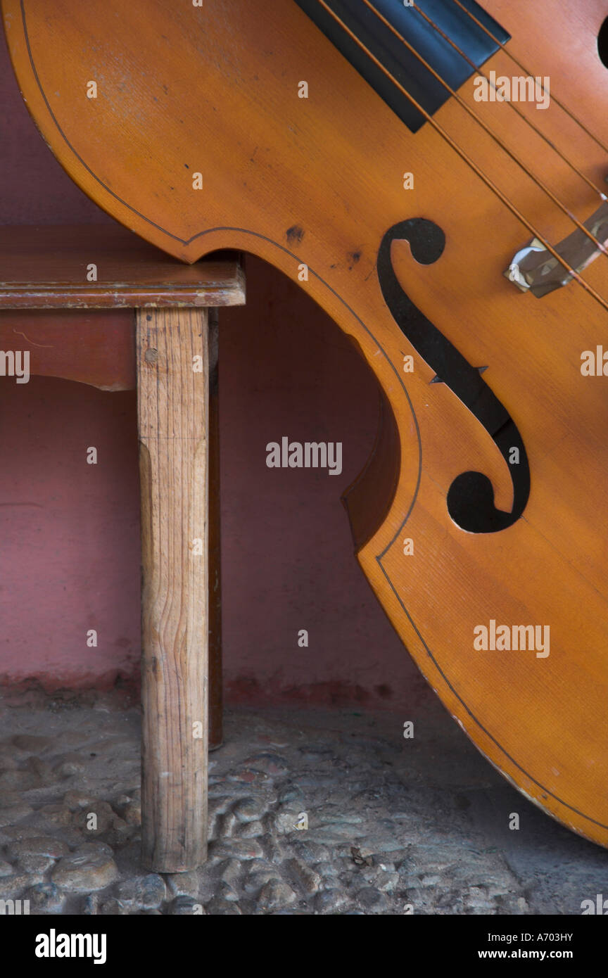 Close up of a counterbass leaning against a wooden table Trinidad Sancti Spiritus province Cuba West Indies Central America Stock Photo