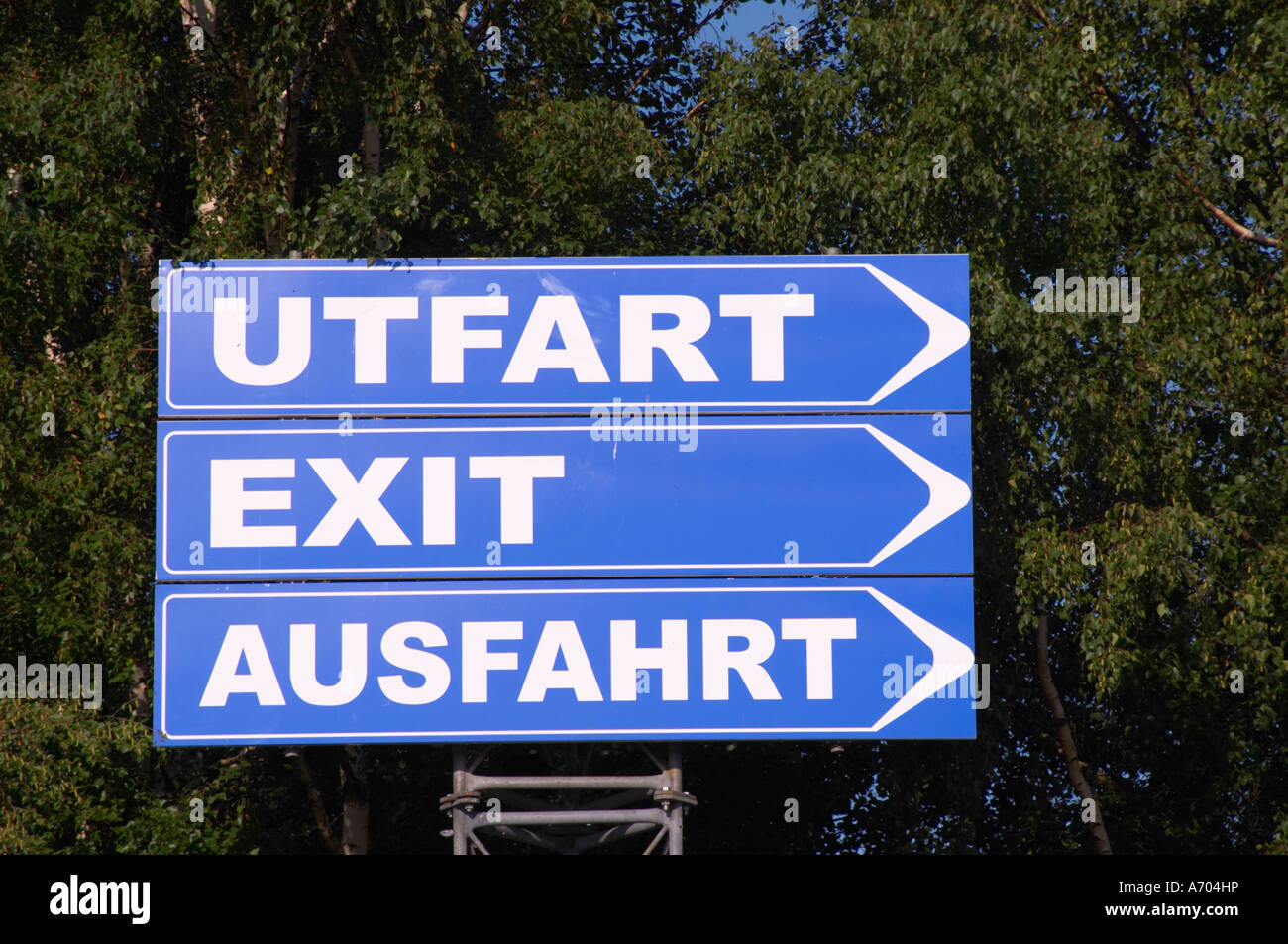Signs saying exit in three languages, Swedish, Utfart, English, Exit, German, Ausfahrt at Astrid Lindgren's World. Vimmerby town Smaland region. Sweden, Europe. Stock Photo