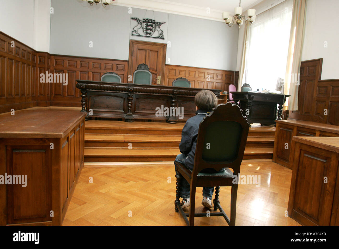 12.07.2005, Weinheim, DEU, child sits before the judge's chair of the district court Stock Photo