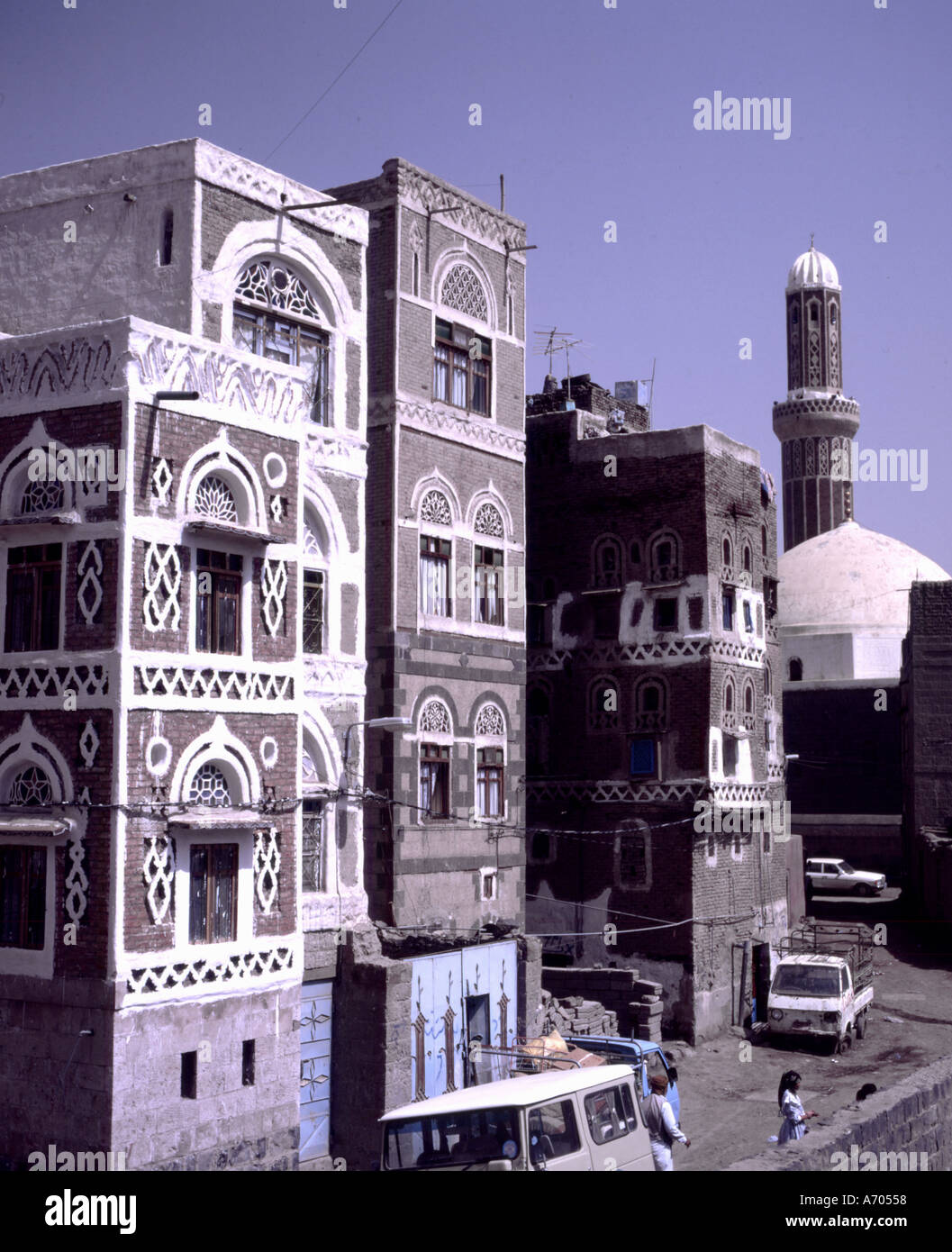 yemen jemen sanaa city traditional houses street mosque tower minaret at the saila Stock Photo